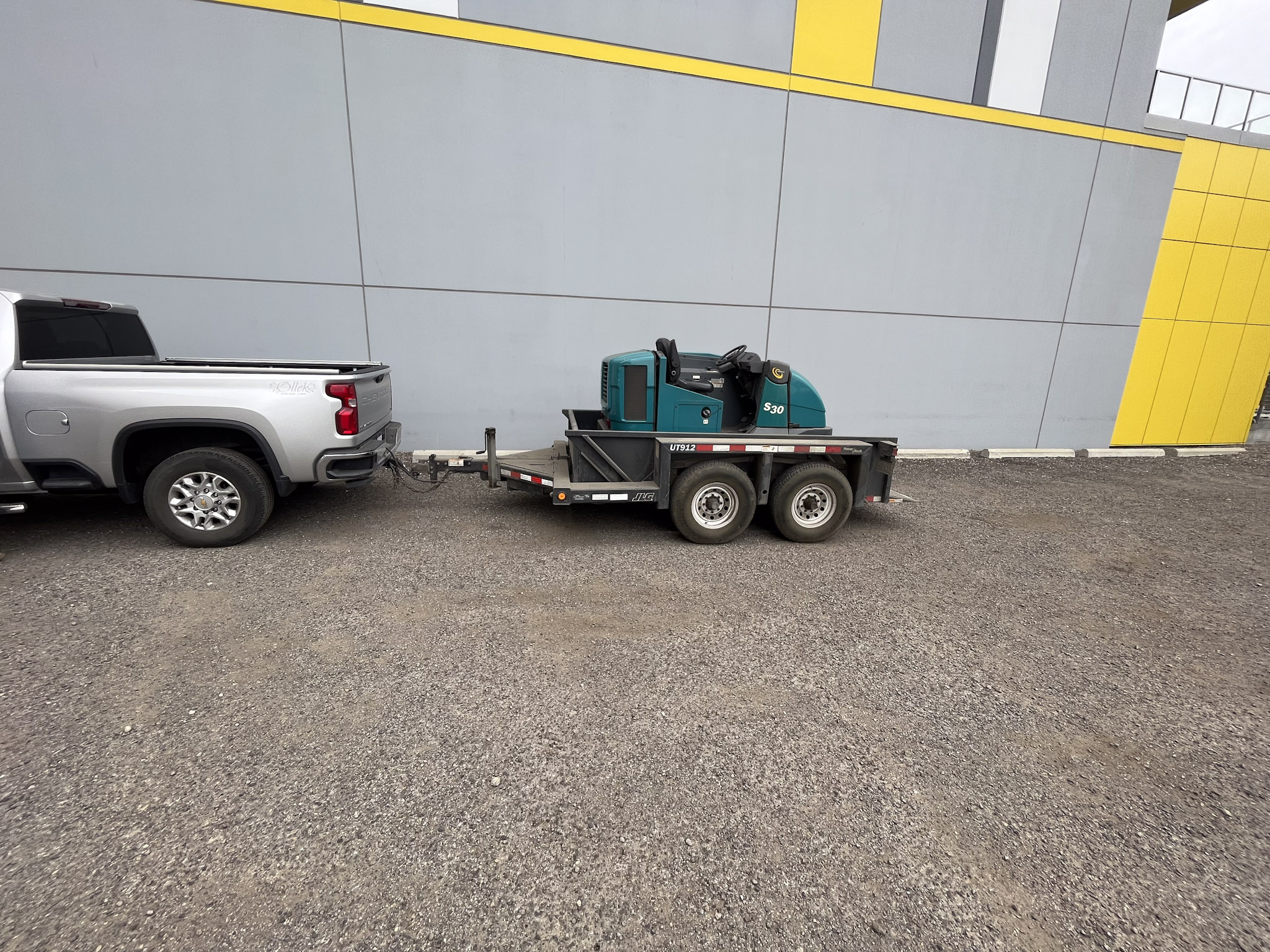 Sweeper and haul truck on site