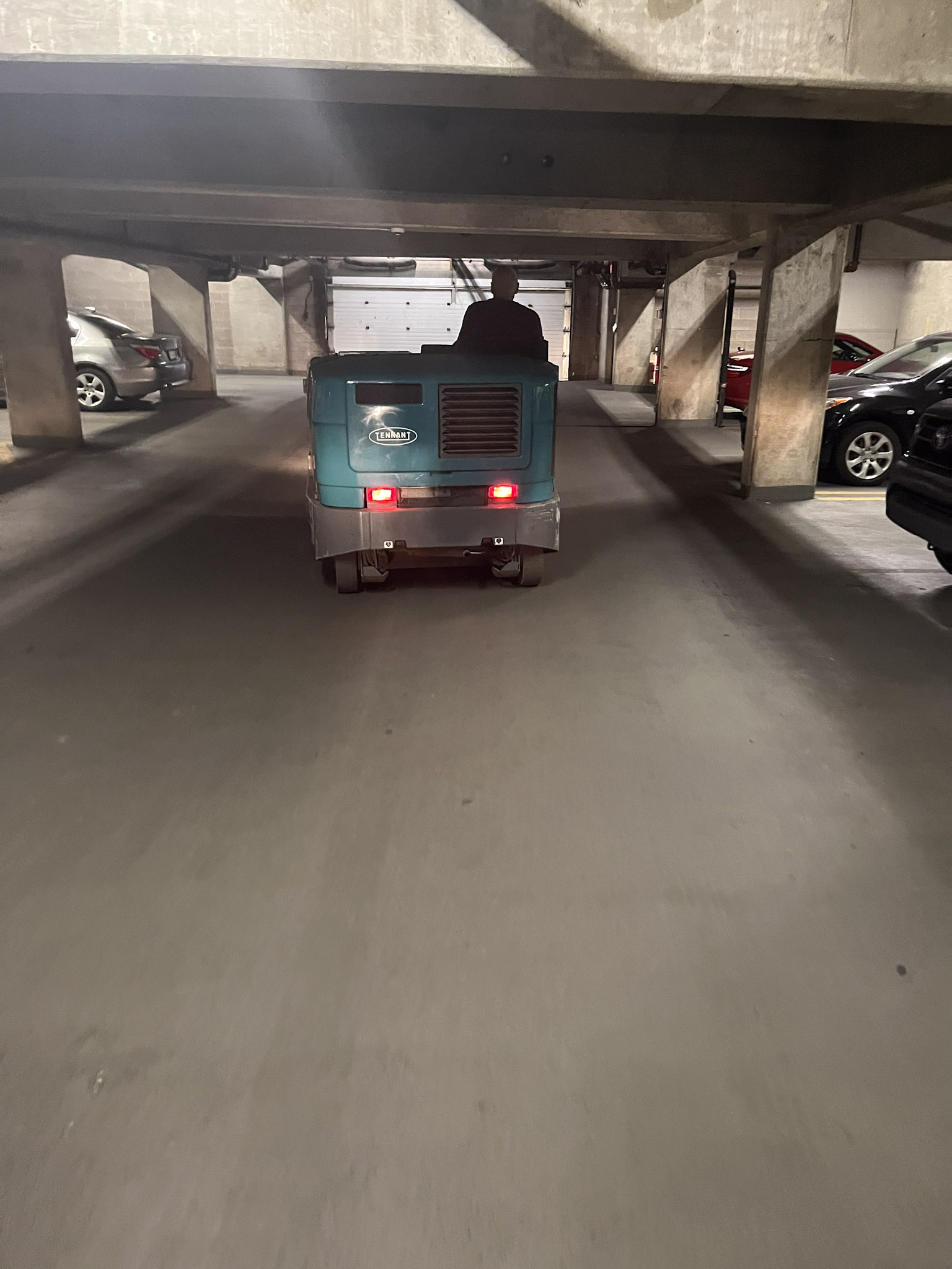 Parkade sweeping with compact sweeper